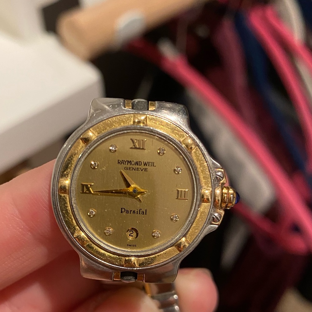 Raymond Weil woman’s watch. Gold face with diamonds